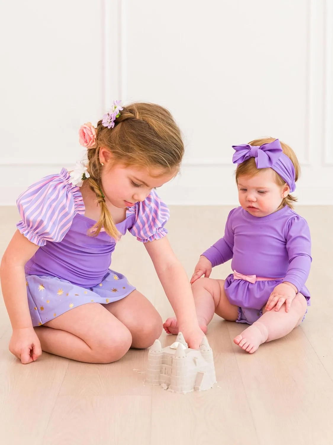 RuffleButts Baby Girls UPF50  Princess Long Sleeve Bow Skirted One Piece Swimsuit