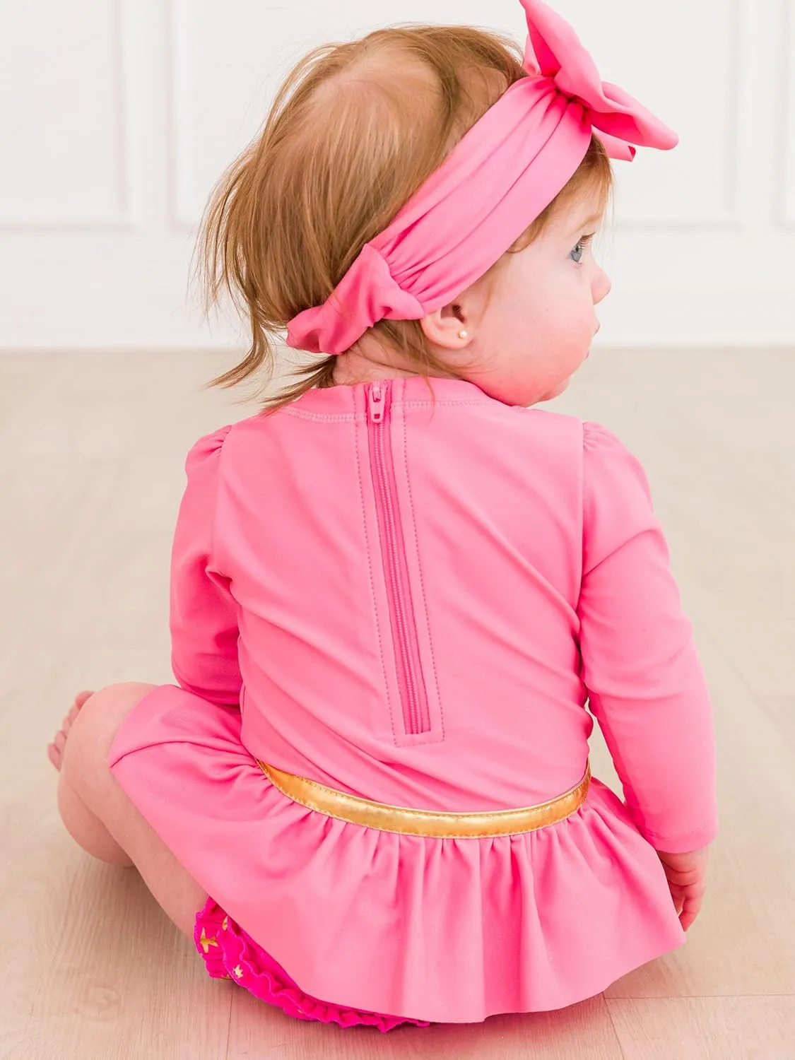 RuffleButts Baby Girls UPF50  Princess Long Sleeve Bow Skirted One Piece Swimsuit