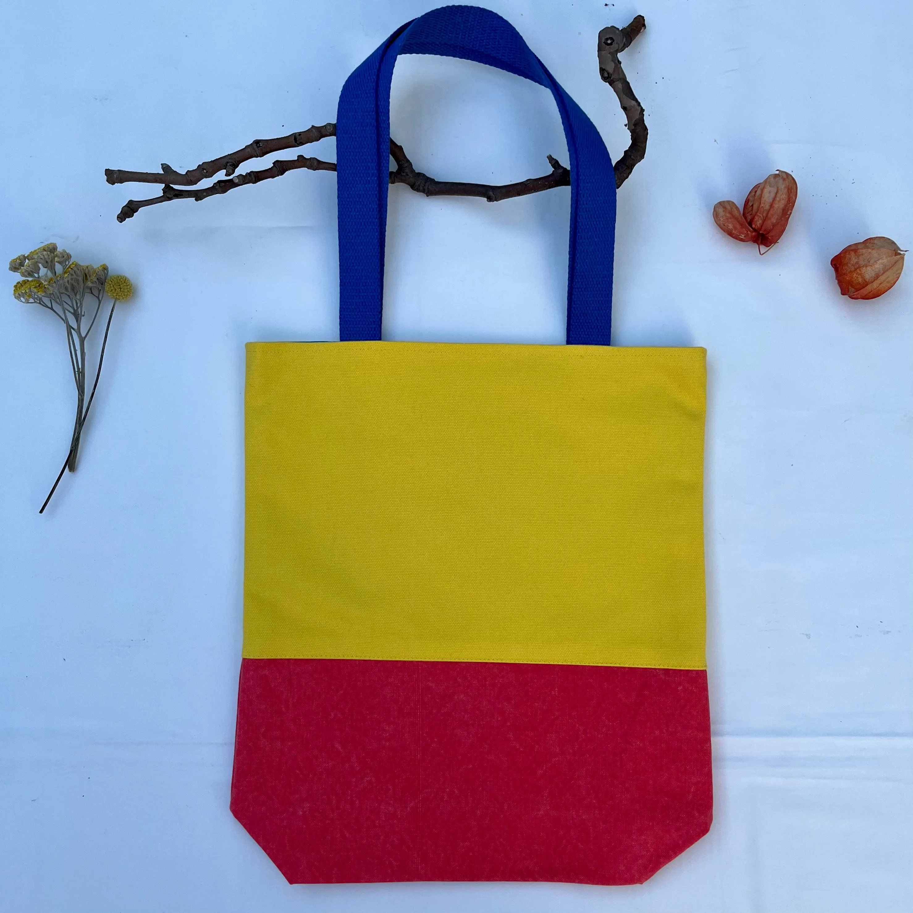 Tote bag. Vibrant yellow and red cotton canvas tote bag. Lined with a royal blue pattern cotton fabric.