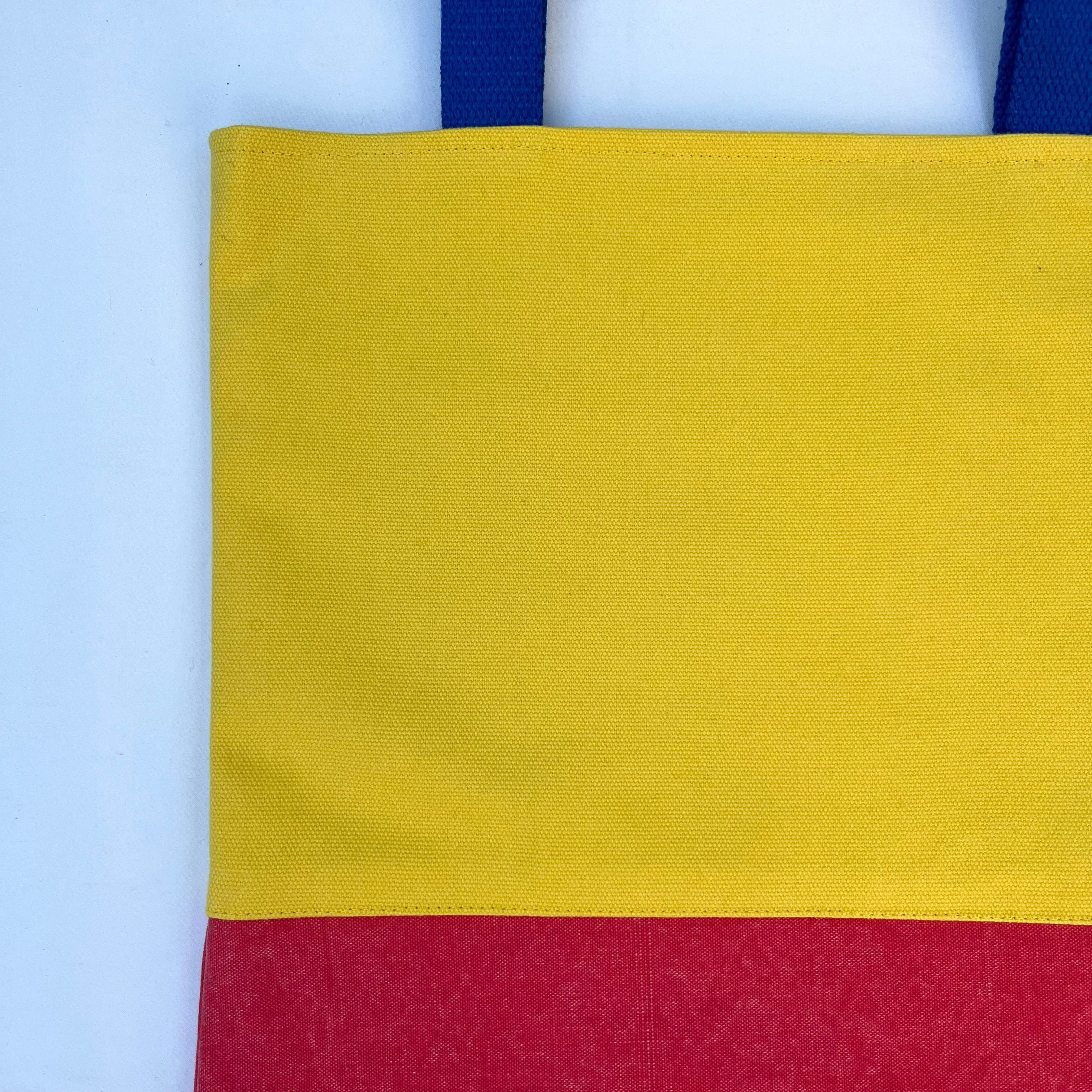 Tote bag. Vibrant yellow and red cotton canvas tote bag. Lined with a royal blue pattern cotton fabric.