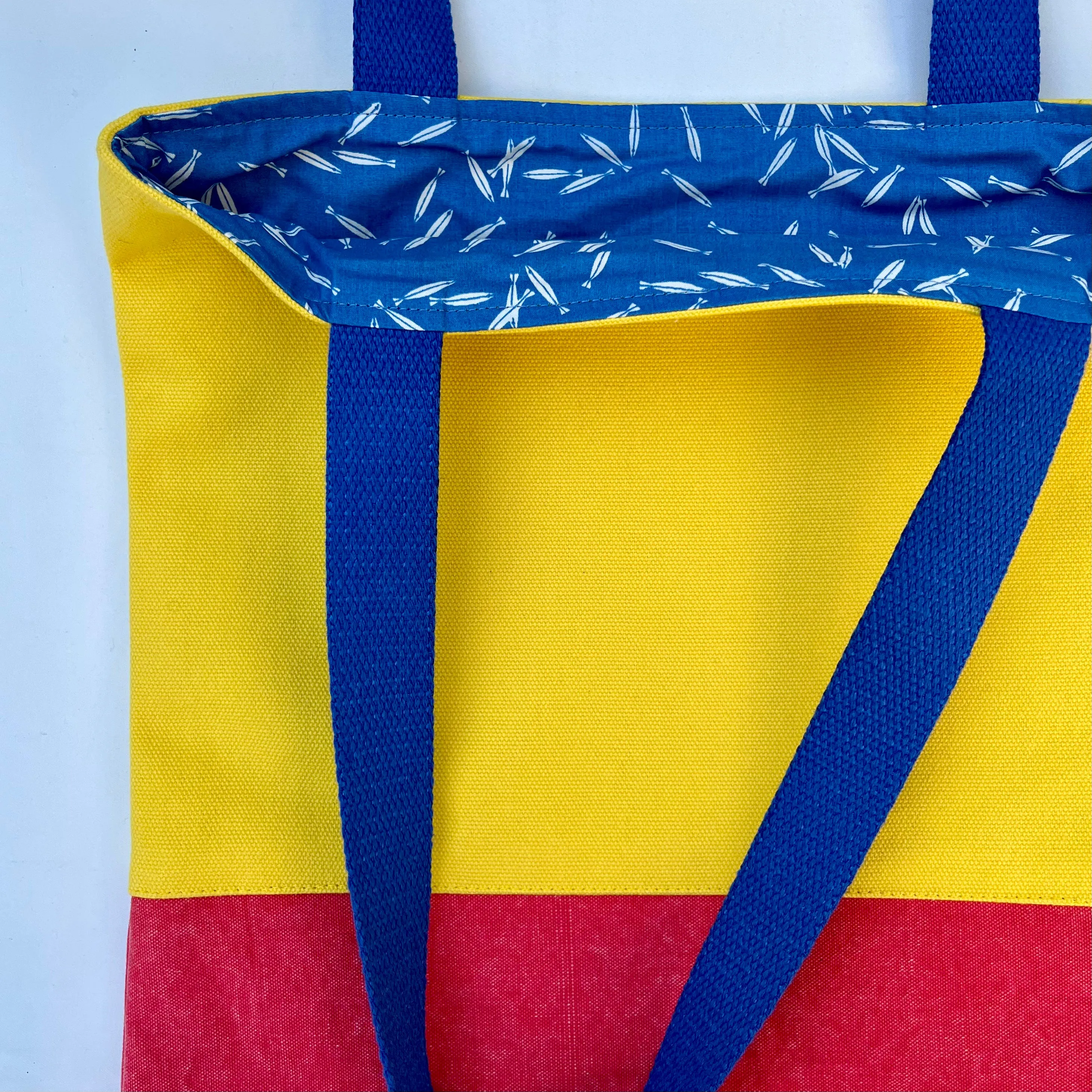 Tote bag. Vibrant yellow and red cotton canvas tote bag. Lined with a royal blue pattern cotton fabric.